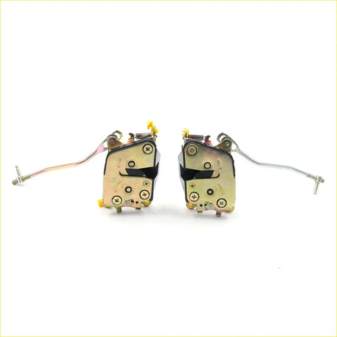 Pair of gold-toned metal door lock actuators with black plastic parts and wiring for Toyota Hilux 3rd Gen 1978-1983