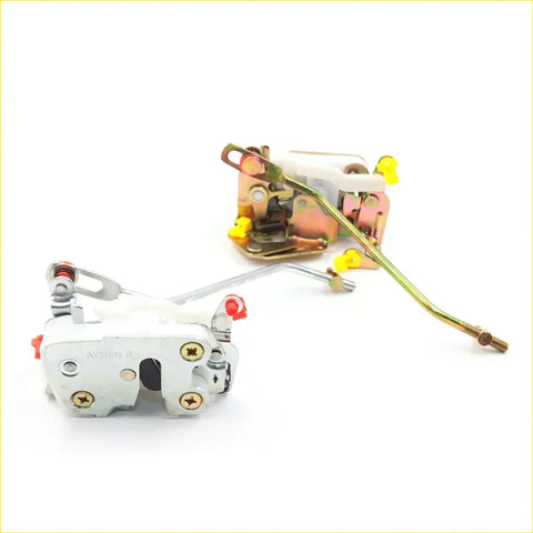 White and metallic door lock actuators latch with red and yellow accents for mazda b series 1987-1993 close up