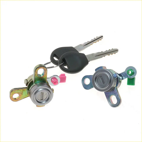Two metallic door lock cylinders with black key fobs and colored plastic parts for nissan almera n16 pulsar 2000-2006