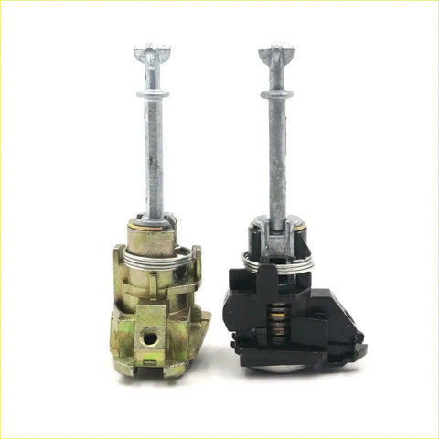 Two door lock cylinders for toyota hilux 2004-2015 with brass metal and black plastic housing shown from back side