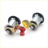 Silver door lock cylinders with brass brackets and black rubber seals for nissan sentra 1995-1999 shown from back side