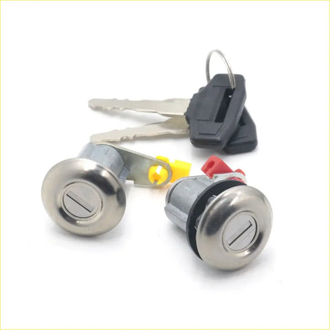 Two metallic circular ignition lock cylinders with brushed silver finish and black seals for mitsubishi fuso fighter door lock