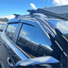 Black plastic roof rack with integrated led light bar mounted on dark suv for ldv 2017 current door visors window monsoons weather shields