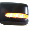 Black plastic electric door mirror with amber led turn signal lights for nissan d22 navara np300 shown from back side