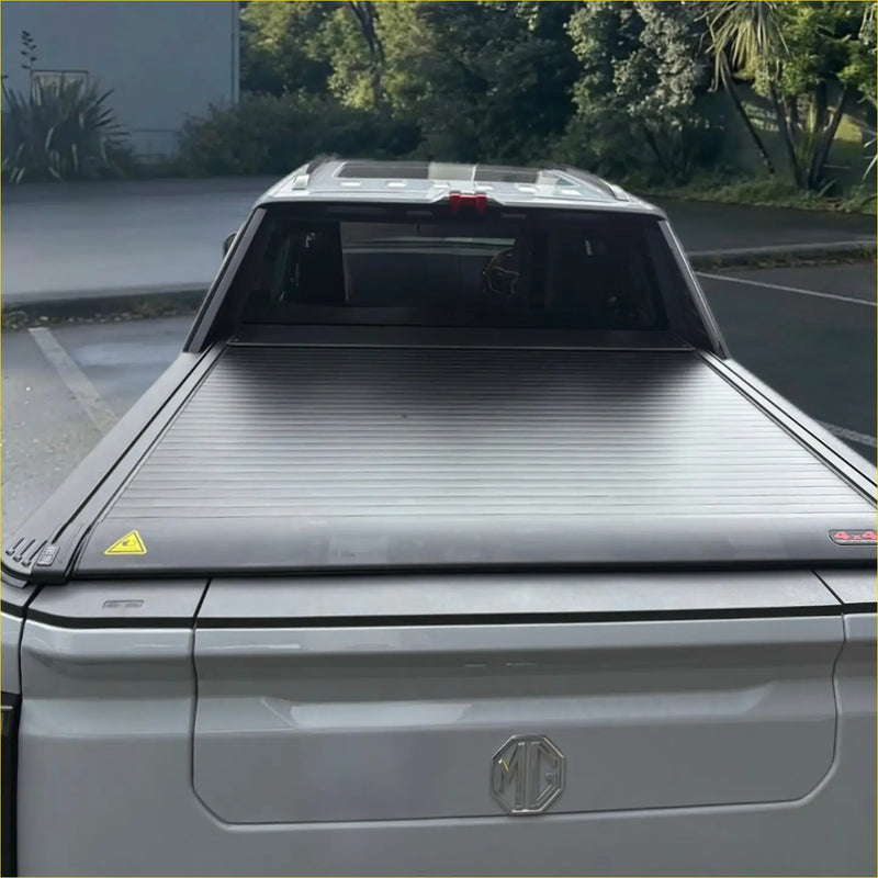 Silver electric roller shutter tonneau cover with ribbed texture and subtle branding for ldv terron 9 truck bed