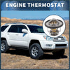 Silver engine coolant thermostat for toyota 4runner 3.4l with brass central element and spring mechanism visible