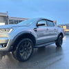 Silver ford ranger px3 2019-2021 with black wheels side steps and smooth style 4-inch fender flare visible from back