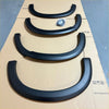 Black matte finish plastic fender flares in descending size for isuzu d-max 2012-2016 oem style on cardboard