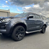 Dark gray metallic isuzu d-max 2021-2023 with matte black 4-inch smooth style fender flares and black alloy wheels