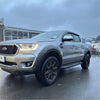 Silver ford ranger px2 2016-2018 with black wheels and 7-inch lychee texture bolt-on fender flare seen from the back