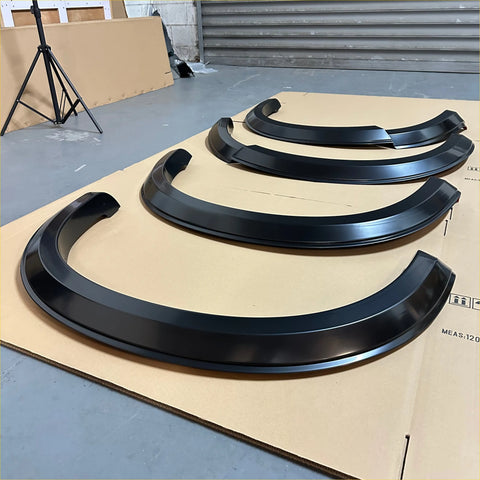 Black glossy finished matte black 4-inch smooth style fender flares for isuzu d-max 2016-2020 on cardboard