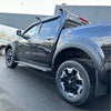 Black mitsubishi triton pickup with chrome accents and black alloy wheels featuring matte black bolt style fender flare for nissan navara 2021+