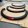 Black curved fender liners with red accent panels for nissan navara 2021+ oem style matte black with red layer