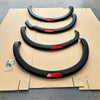 Black fender flares with red accent strips for nissan navara np300 2015-2020 oem style vehicle customization