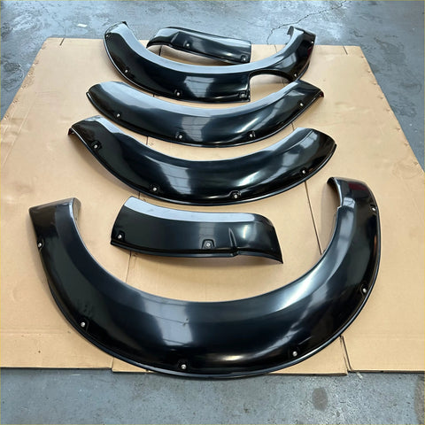 Black glossy finished aftermarket bolt style fender flare for nissan navara np300 2015-2020 with smooth curved design and mounting points