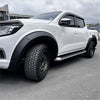 White nissan navara np300 pickup with matte black fender flares alloy wheels and side steps oem style 2015-2020
