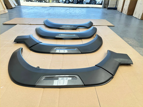 Black matte finish fender flares with integrated chrome strips for toyota hilux 2021-2024 sr5 cruiser oem style gray