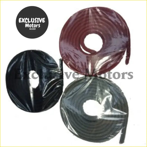 Three coiled rolls of ford anglia 105e door shut edge trim in maroon and black wrapped in clear plastic