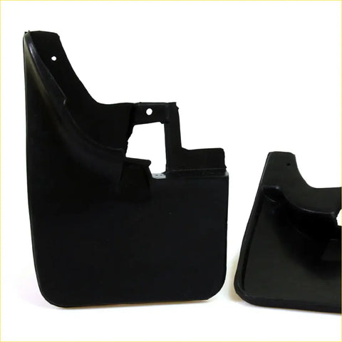 Black plastic front mud guard flap set with molded contours and mounting holes for nissan navara d22 1997-2004