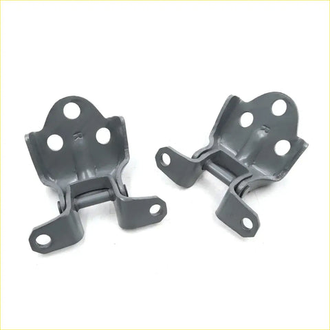 Gray metal hinge brackets with matte finish and multiple mounting holes for frt rhs door hinges mitsubishi triton l200
