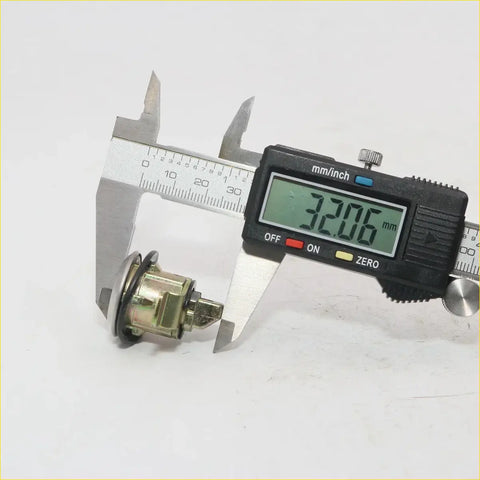 Fuel lid gas lock with key for datsun nissan sunny 1973-1983 showing metallic brass body cylindrical car headlight switch back side