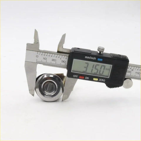 Shiny chrome gas filler lock for nissan d22 np300 king cab 1997-2021 shown with keyhole measured 31.5 mm