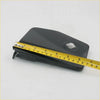 Black plastic gas fuel door cover with circular cutout and angular design for nissan navara power eagle shown from back