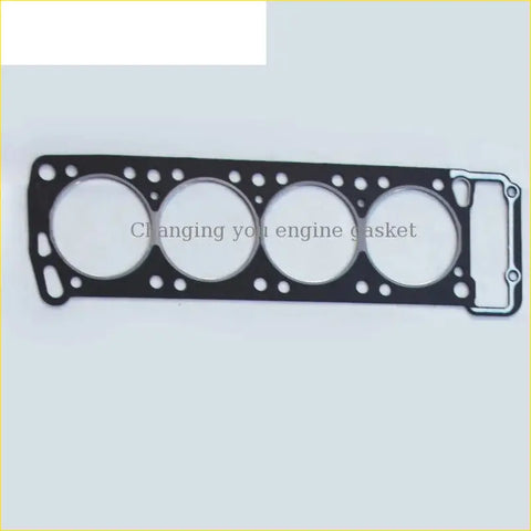 Black engine head gasket with four circular openings and metallic edge for mitsubishi pajero and mazda b-serie engines