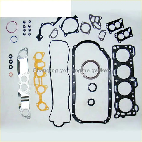 Neatly arranged black yellow and silver gasket pro 4za1 full set for isuzu fargo tfr tfs 1.6l engine on white surface