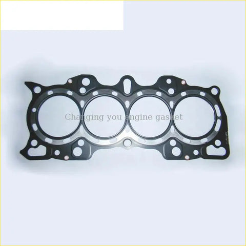 Black engine head gasket with four circular openings and metallic fastener holes for honda integra 1.8l 16v pro gasket