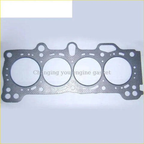 Black cylinder head gasket with four circular openings and textured surface for gasket pro b20a honda prelude accord iii