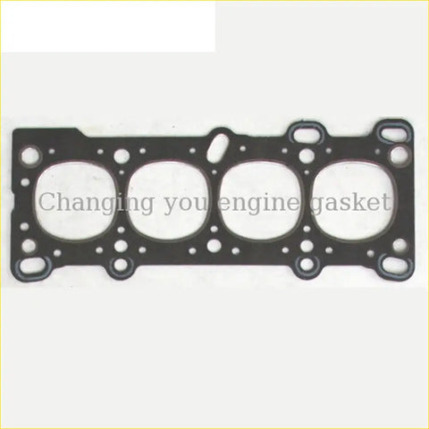 Black engine head gasket with four circular openings and edge holes for mazda familia 323 16v sohc diesel model