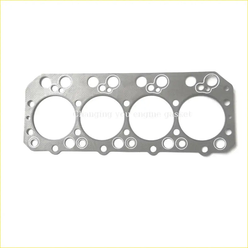Silver metallic engine head gasket with four large circular openings and bolt holes for nissan truck cylinder head use