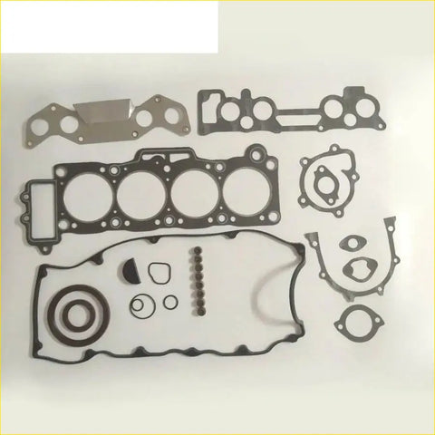Black and silver engine gasket set for mazda 626 2.0l featuring various shapes and hole patterns for automotive use