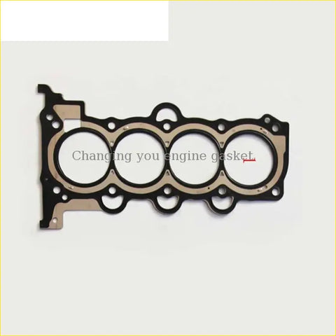 Black and beige engine head gasket with four circular openings for hyundai or kia cerato ii g4fc cylinder head gasket use