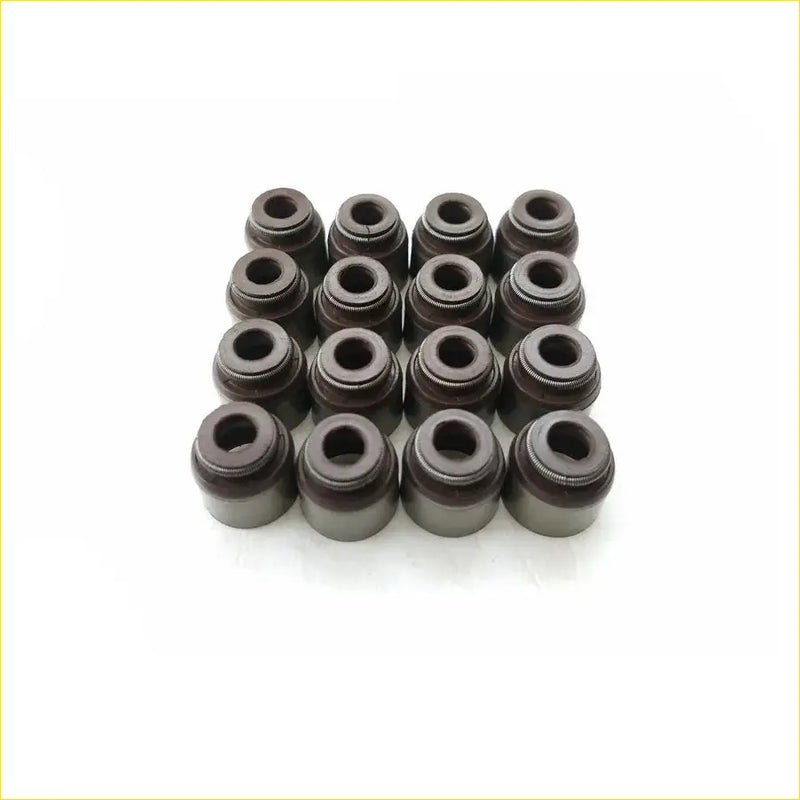 Black valve stem oil seals arranged in a grid for gasket pro nissan micra iii k12 160 sr hr16de 16pcs set
