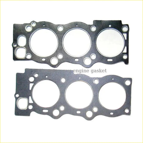 Black engine gasket with three circular openings and mounting holes for gasket pro toyota camry 25l 16v 2vzfe