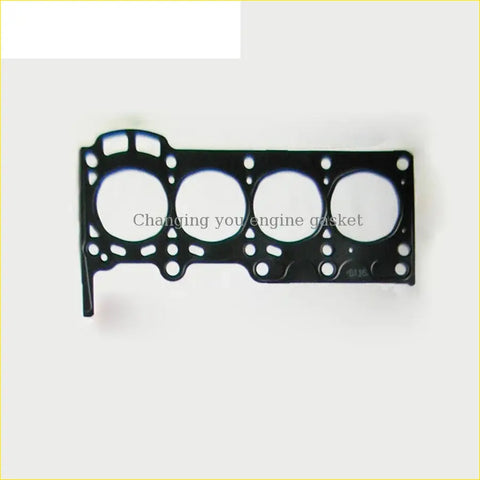 Black engine head gasket with four circular openings and textured surface for toyota yaris echo 1 0 1szfe engine