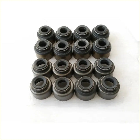 Black metal valve stem oil seals arranged in a grid for gasket pro fp fs mazda premacy and 626 iv models