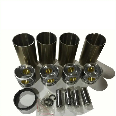 Set of four metallic engine pistons and cylinder liners with gold piston tops for great wall diesel engines