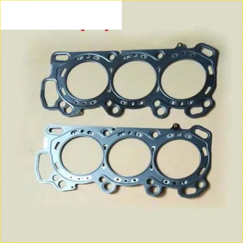 Two metallic engine head gaskets in dark and light tones for gasket pro 3.5 j35a honda shuttle odyssey pilot