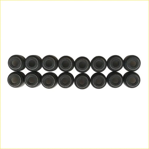 Black cylindrical valve stem oil seals arranged in two neat rows for gasket pro nissan xtrail t30 16pcs set