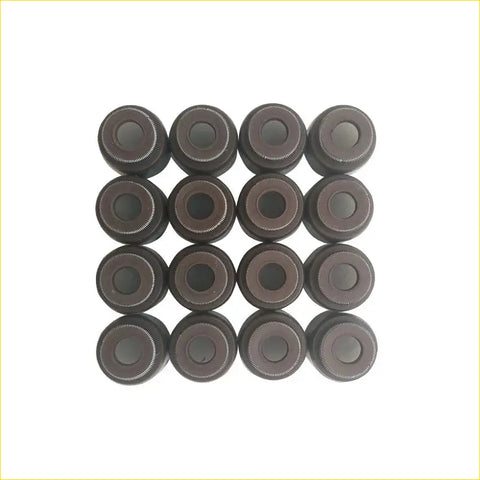 Dark gray metallic valve stem oil seals arranged in a grid for toyota prius nhw11 1nz-fxe engines by gasket pro