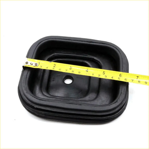 Black rubber engine oil pan gasket with layered ridges and central hole for gear lever shift boot nissan patrol maverick