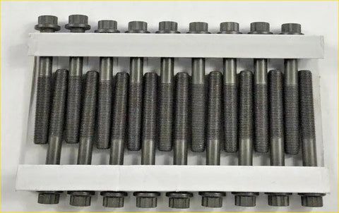 Set of twelve dark gray metallic head bolts with hex heads for 2.5 td did 16v engines in a white tray