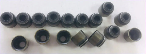 Black metal valve stem seals arranged in rows for nissan navara pick up d22 25di yd25ddt head gasket set and bolts