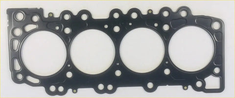 Black engine head gasket with four circular openings and textured reinforced design for nissan navara d22 2001–2005