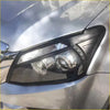 Black headlight covers with clear lens and chrome accents for isuzu d max 2012-2016 mounted on silver car body