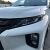 Matte black headlight covers for white mitsubishi triton 2019-2023 with sleek black trim and modern led design