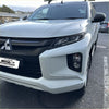 White mitsubishi triton pickup with sleek modern design and matte black headlight covers 2019-2023 model